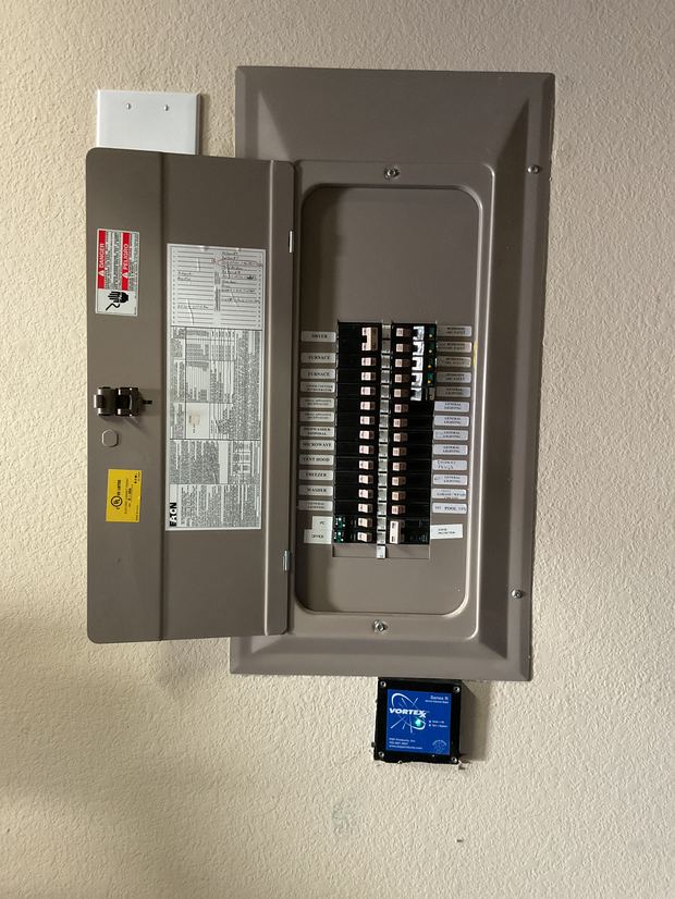Eaton panel in an Austin home with a PSP Vortex Series R surge protector installed below it