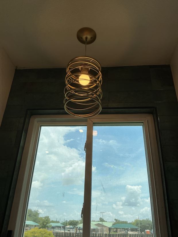 Pendant light installed over a window in a Cedar Park kitchen