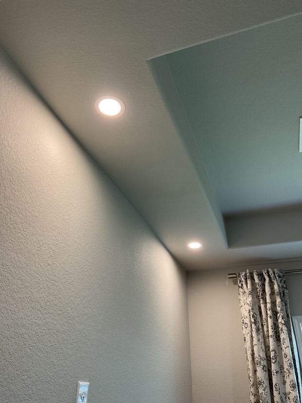 Recessed lights installed in a tray ceiling in a Round Rock living room