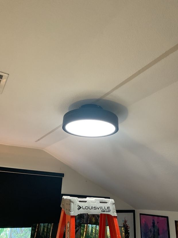 Low-profile flush-mount ceiling fan with light installed in a Leander home